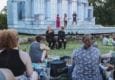Photo of performers and audience members in Forest Park