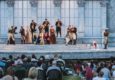 Photo of performers and audience members in Forest Park